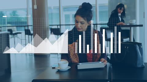 Woman Analyzing Graphs While on Coffee Break