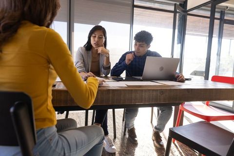 Dynamic Team Engaged in Office Meeting Discussion