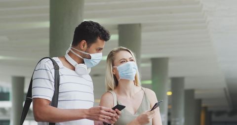 Couple Exploring City Streets with Smartphones and Face Masks - Download Free Stock Images Pikwizard.com