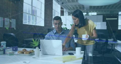 Colleagues Collaborating in Modern Workspace on Business Project