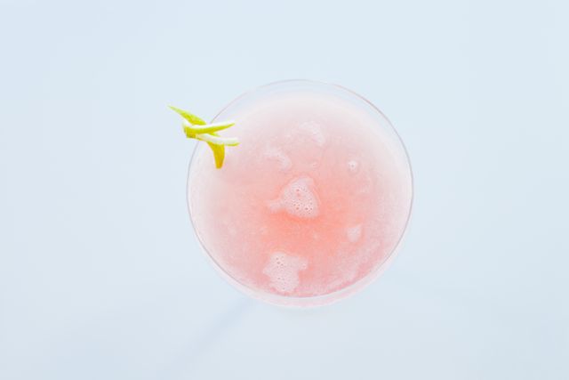 Top View of Pink Cocktail with Lemon Garnish in Elegant Glass - Download Free Stock Photos Pikwizard.com