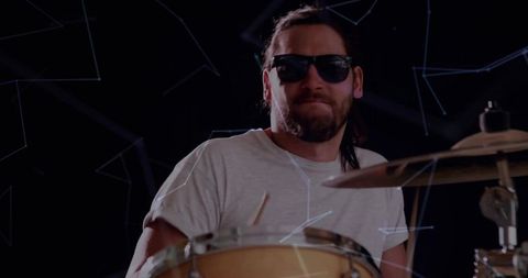 Stylish drummer performing with cosmic artistic flair
