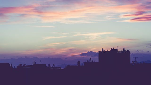 Silhouette of Cityscape at Sunset with Colorful Sky - Download Free Stock Photos Pikwizard.com