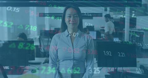 Asian Businesswoman in Office with Stock Market Overlay
