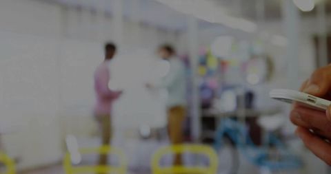 Using Smartphone in Modern Office Environment with Colleagues