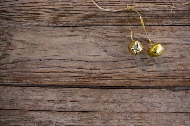 Christmas Bells Hanging on Rustic Wooden Background - Download Free Stock Photos Pikwizard.com