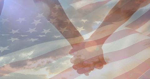 Couple Holding Hands Overlaid with American Flag for Patriotism