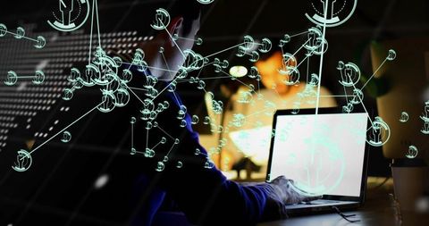 Developer typing on laptop with network visualization overlay for data analytics and teamwork