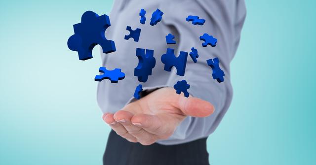 This image shows a businessman extending his hand as blue jigsaw puzzle pieces float towards him. Ideal for illustrating concepts related to problem-solving, strategic planning, creativity, teamwork, and business solutions.