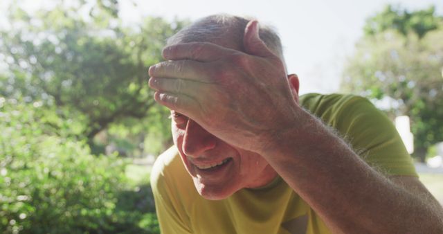 Senior Man Wiping Sweat from Forehead During Outdoor Activity - Download Free Stock Images Pikwizard.com