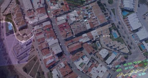Revealing aerial coastal neighborhood with terracotta roofs, pools and financial data overlay