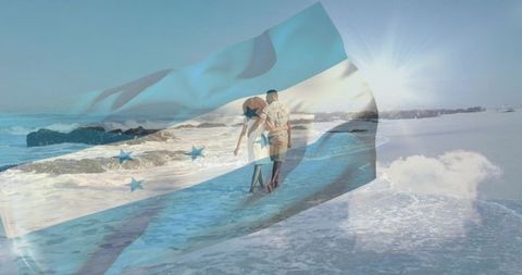 Romantic couple walking along sunlit shoreline with honduras flag overlay