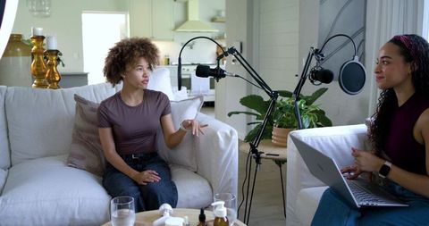 African American Women Recording Podcast in Bright Living Room with Boom Microphones