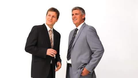 Businessmen Engaged in Friendly Conversation with Keys in Hand