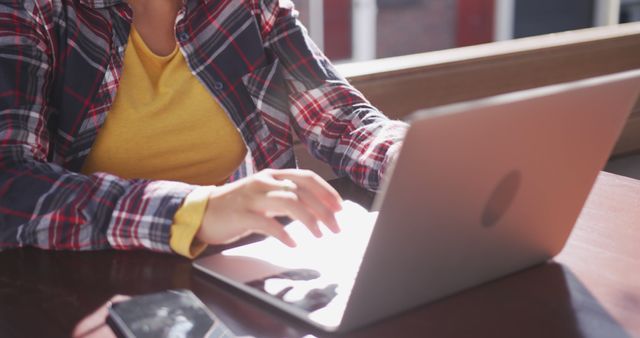 Person Typing on Laptop in Cafe Wearing Plaid Shirt - Download Free Stock Images Pikwizard.com