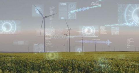 Wind turbines over canola field with augmented reality overlays for energy monitoring