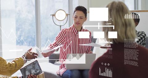 Mixed-Race Team Engaging in Data Analysis with Digital Interfaces