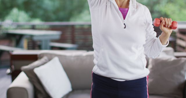 Woman Exercising Outdoors with Dumbbells - Download Free Stock Images Pikwizard.com