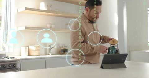 Man pouring French press coffee while using tablet in bright modern kitchen with hologram