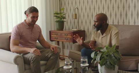 Men engaged in intense conversation in modern living room