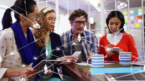 Diverse Team Collaborating on Mobile Devices in Modern Workspace