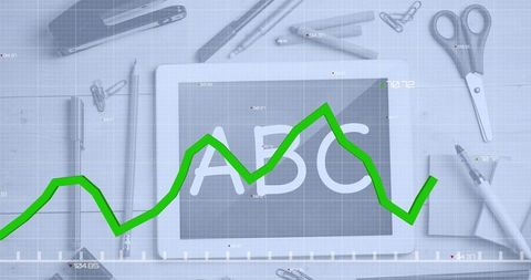 Green Line Graph Overlay on Digital Tablet with Educational Stationery
