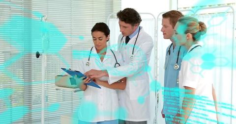 Healthcare team reviewing patient chart with teal digital overlay for clinical teamwork