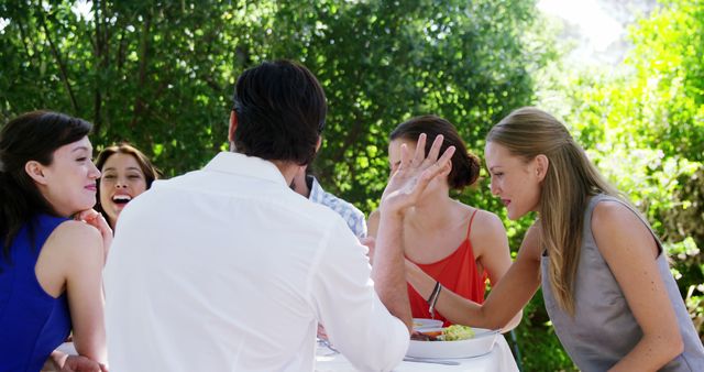 Friends Socializing Outdoors with Lunch at Dining Table - Download Free Stock Images Pikwizard.com