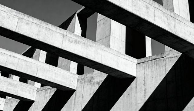 Brutalist Concrete Grid with Bold Diagonal Shadows Emphasizing Geometric Architecture