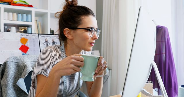 Focused Woman Working on Computer at Home Office with Coffee Mug - Download Free Stock Images Pikwizard.com