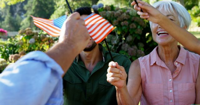 Multigenerational Family Celebrating with American Flags Outdoors - Download Free Stock Images Pikwizard.com