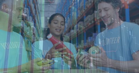 Diverse Volunteers Handling Goods with Financial Data Overlay - Download Free Stock Images Pikwizard.com