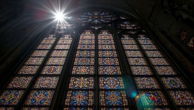 Sunburst illuminates stained glass in historical church