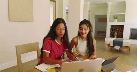 Young Women Collaborating on Creative Design Project