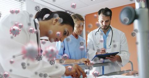 Healthcare Professionals Treating Patient Amidst Floating Virus Cells