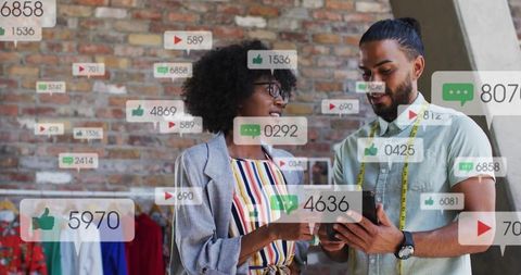 Boutique team checking social media engagement on smartphone with analytics overlays