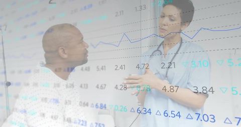 Nurse Reviewing Medical Chart with Patient in Clinic Setting