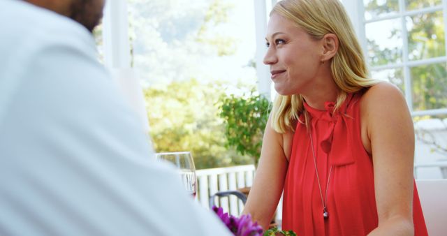 Smiling woman enjoying conversation at bright cafe - Download Free Stock Images Pikwizard.com