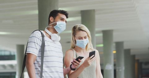 Caucasian Couple Wearing Masks Exploring City Daytime - Download Free Stock Images Pikwizard.com