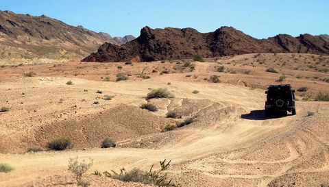 Off-Road Vehicle Traversing Remote Desert Landscape