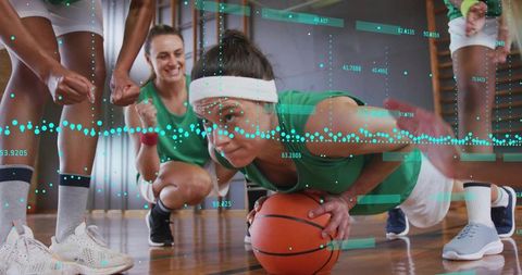 Woman Performing Push-up on Basketball Amid Digital Workout Metrics