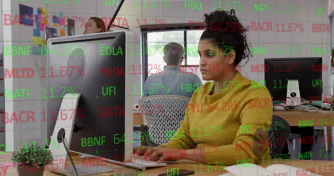 Businesswoman Analyzing Stock Market Data in Modern Office Environment