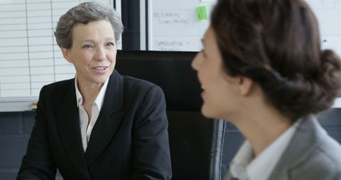 Professional Business Discussion Between Two Women in Modern Office - Download Free Stock Images Pikwizard.com