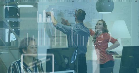 Business professionals collaborating on architectural design in modern office