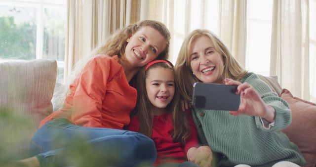 Happy Three-Generation Family Taking Selfie on Couch - Download Free Stock Images Pikwizard.com