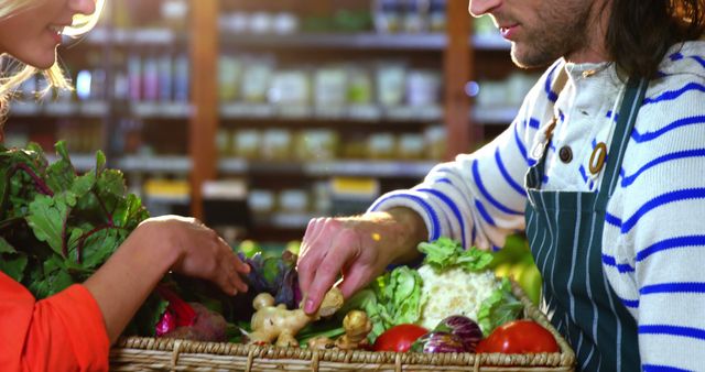 Shopkeeper Assisting Customer with Fresh Vegetables in Grocery Store - Download Free Stock Images Pikwizard.com