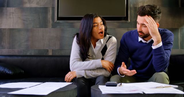 Stressed Couple Discussing Financial Challenges at Home - Download Free Stock Images Pikwizard.com