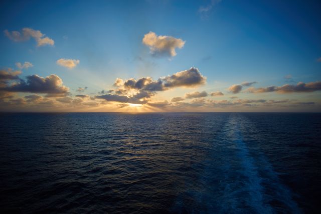 Serene Ocean Sunset with Dramatic Sky - Download Free Stock Photos Pikwizard.com