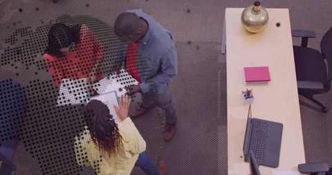 Coworkers Collaborating Over Documents and Tablet