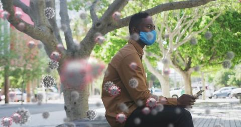 Man with Smartphone Wearing Face Mask During Pandemic